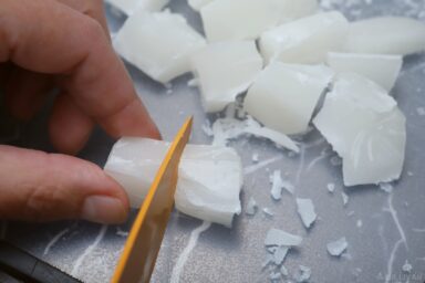 chopping wax with kitchen knife