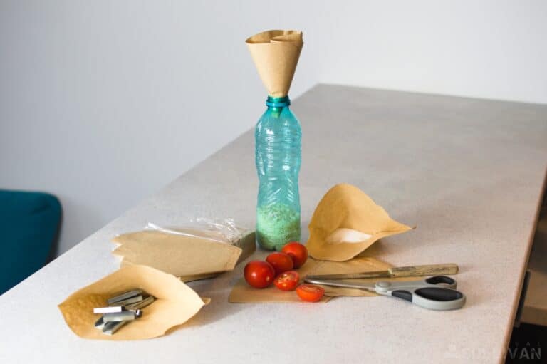 coffee filters next to scissors and plastic bottle