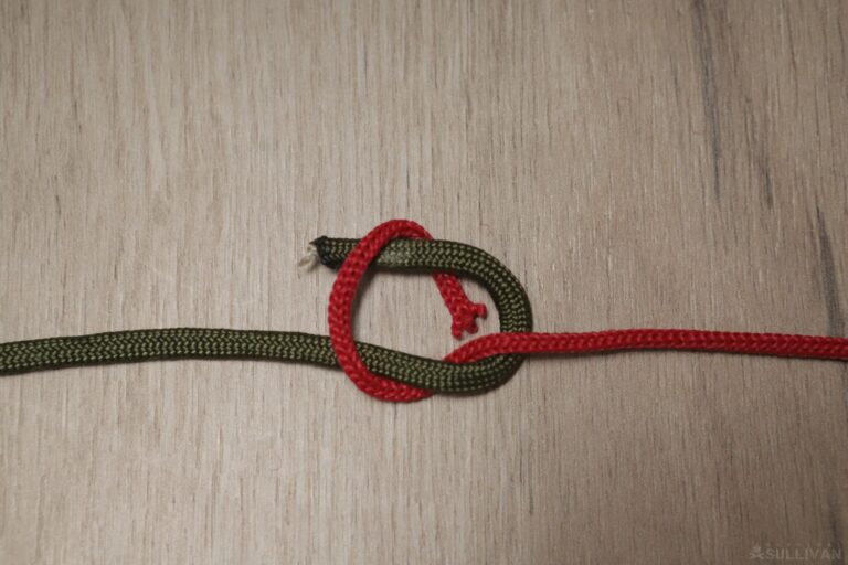 square knot crossing the loose ends to form a loop