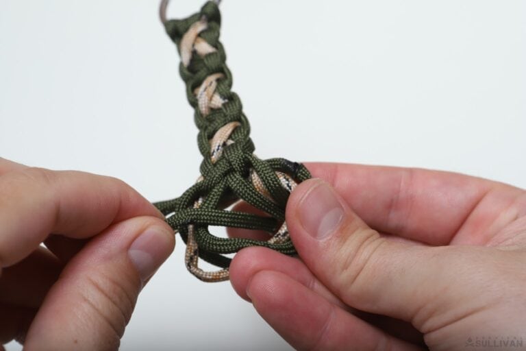 crisscross solomon paracord keychain moving free ends through loop second time