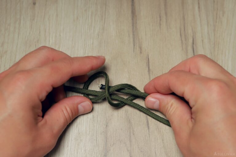 double fisherman’s knot passing free end through both loops