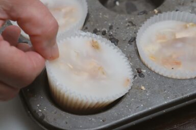 removing sawdust fire starter from muffin tin