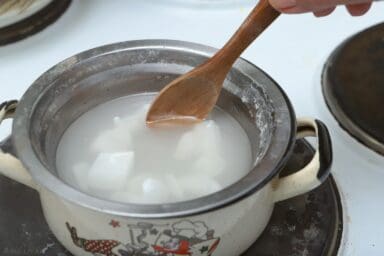 stiring wax in hot water