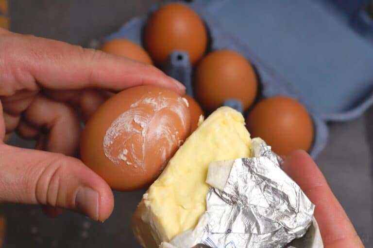 coating an egg with butter