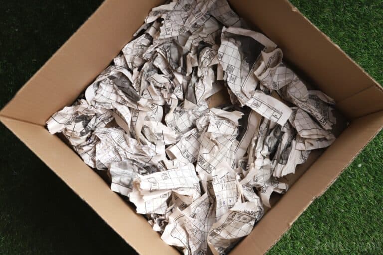 box filled with newspaper
