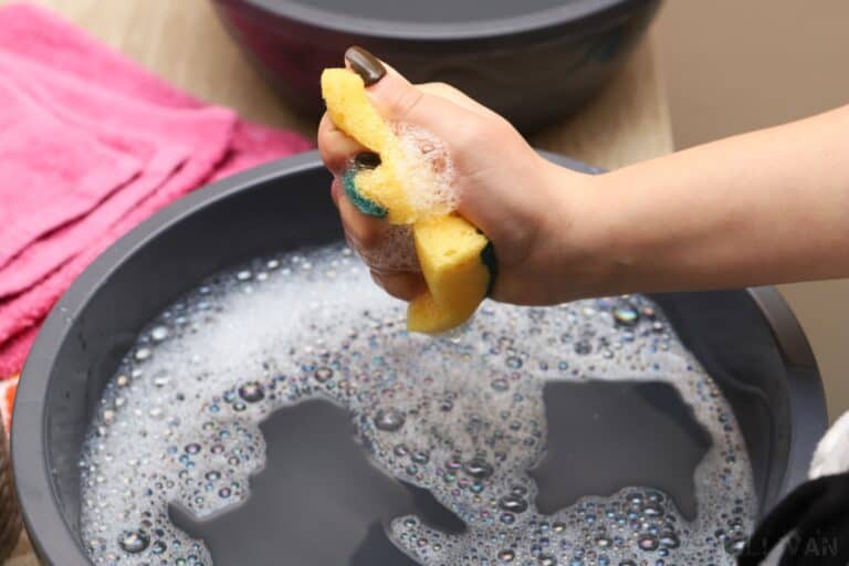 squeezing a soapy sponge