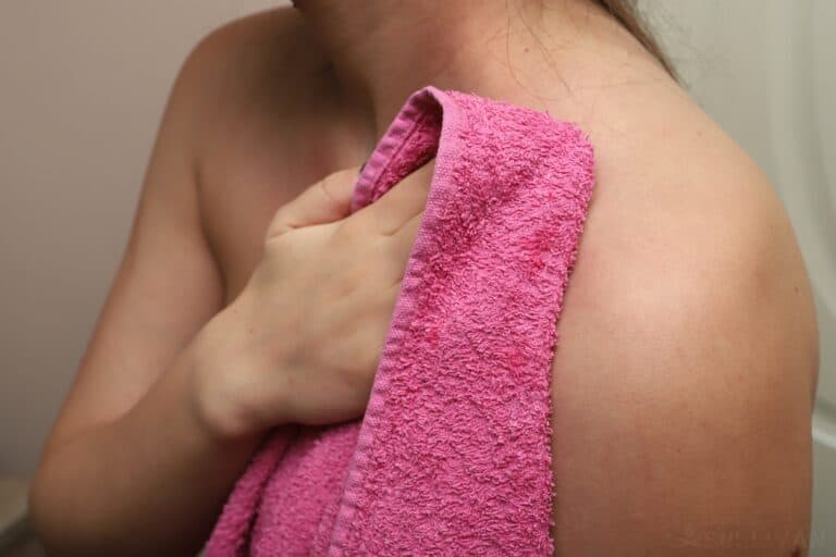 woman drying off with towel