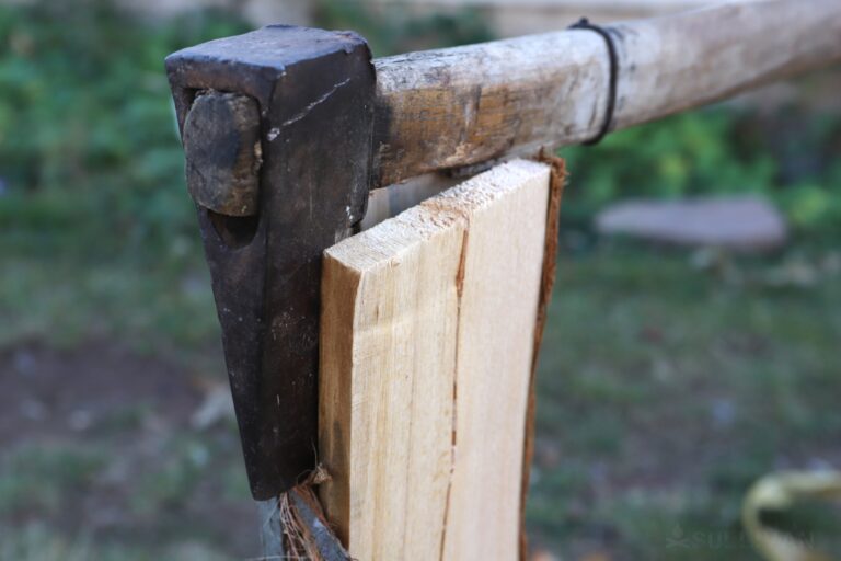 chopping wood log with axe