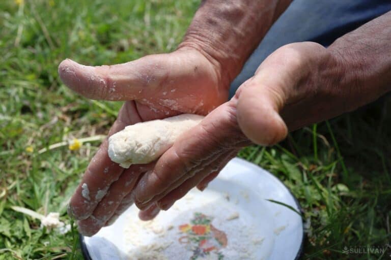 rolling dough with hands