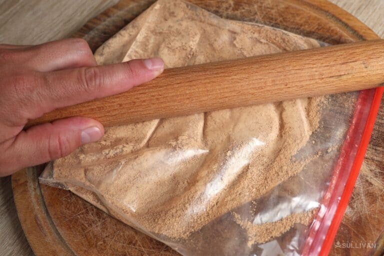 making bark flour with rolling pin