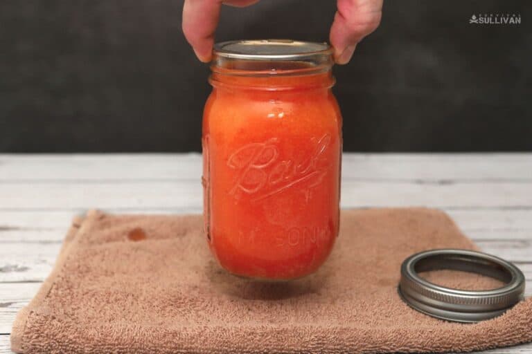 testing tomato sauce jar for a good seal